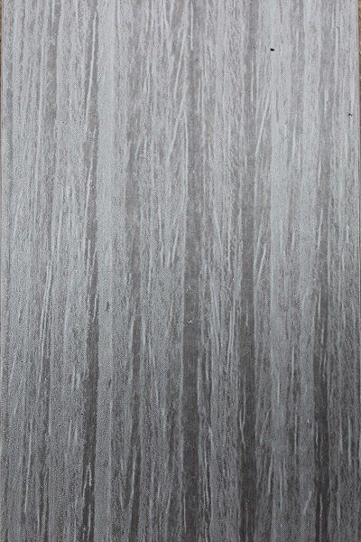 A close up of a piece of gray wood.