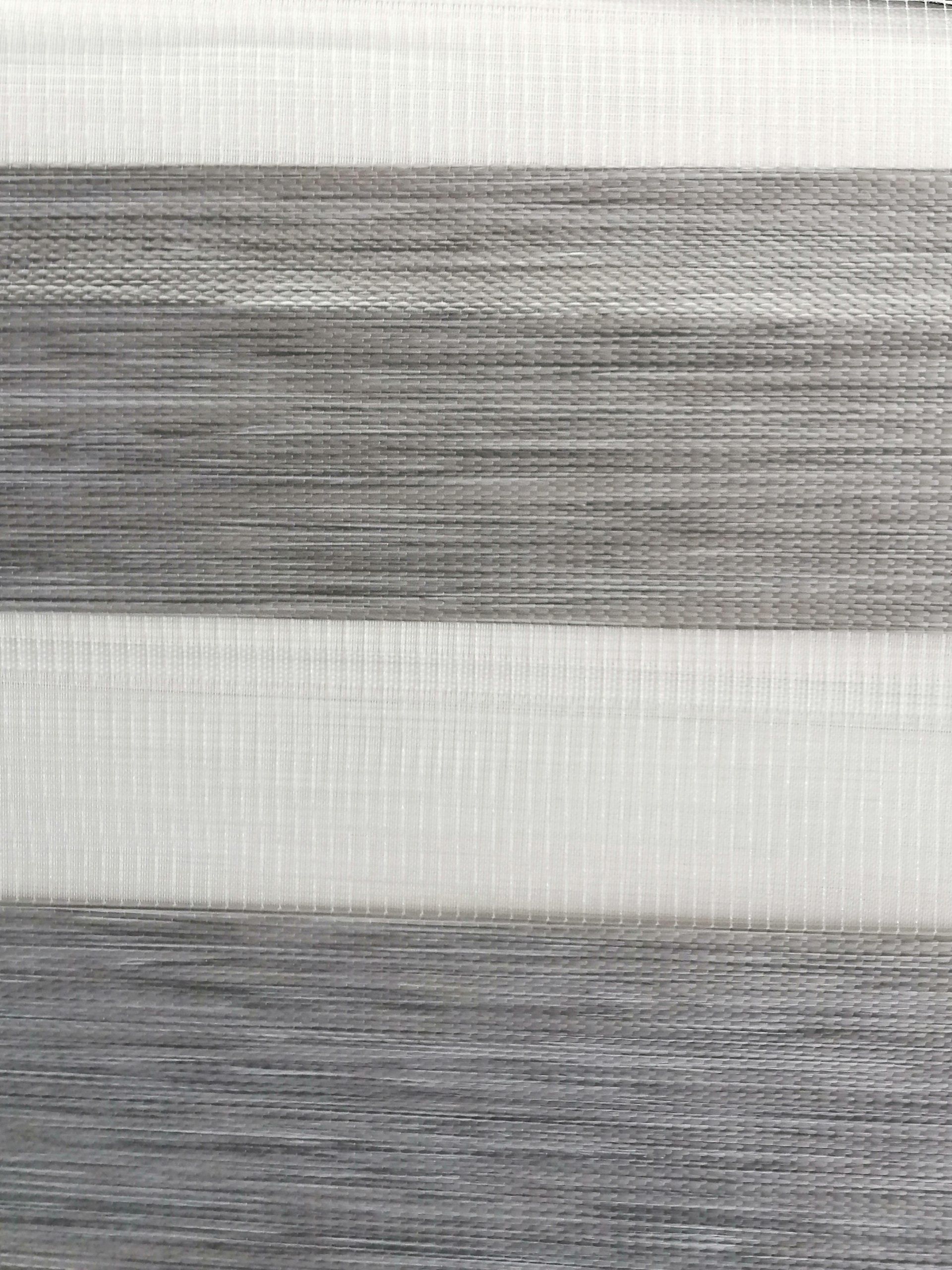 A close up of a gray and white striped fabric.