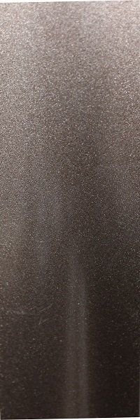 A close up of a stainless steel surface with a brushed finish.