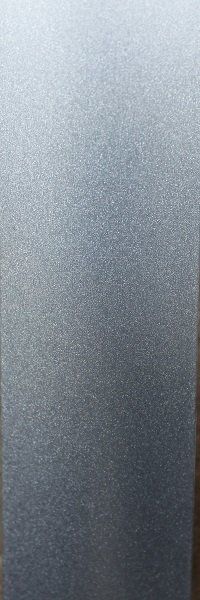 A close up of a stainless steel surface with a brushed finish.