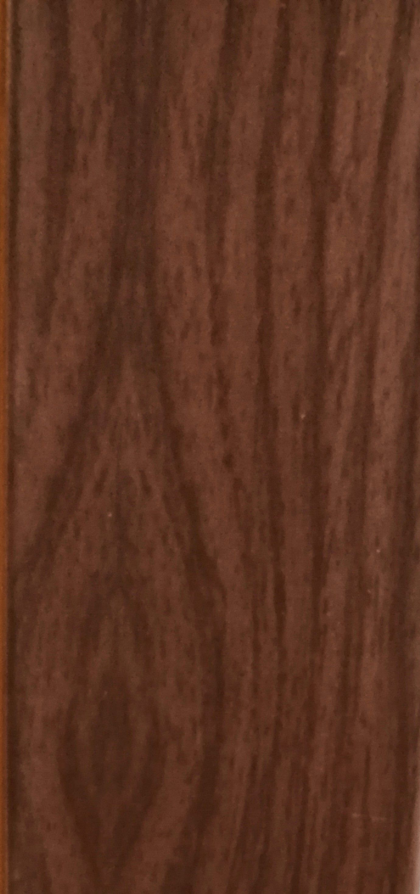 A close up of a piece of brown wood.