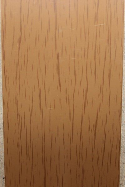 A close up of a piece of wood with a grainy texture.