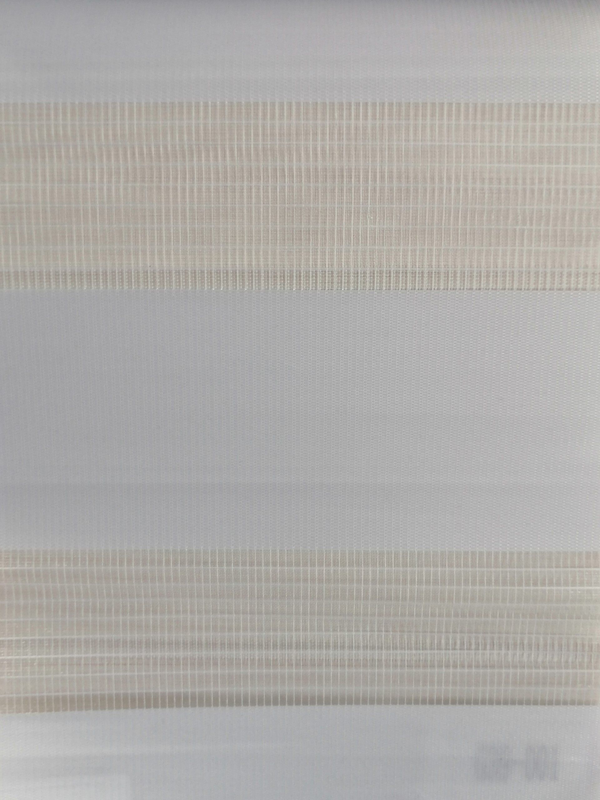 A close up of a piece of fabric with a striped pattern.