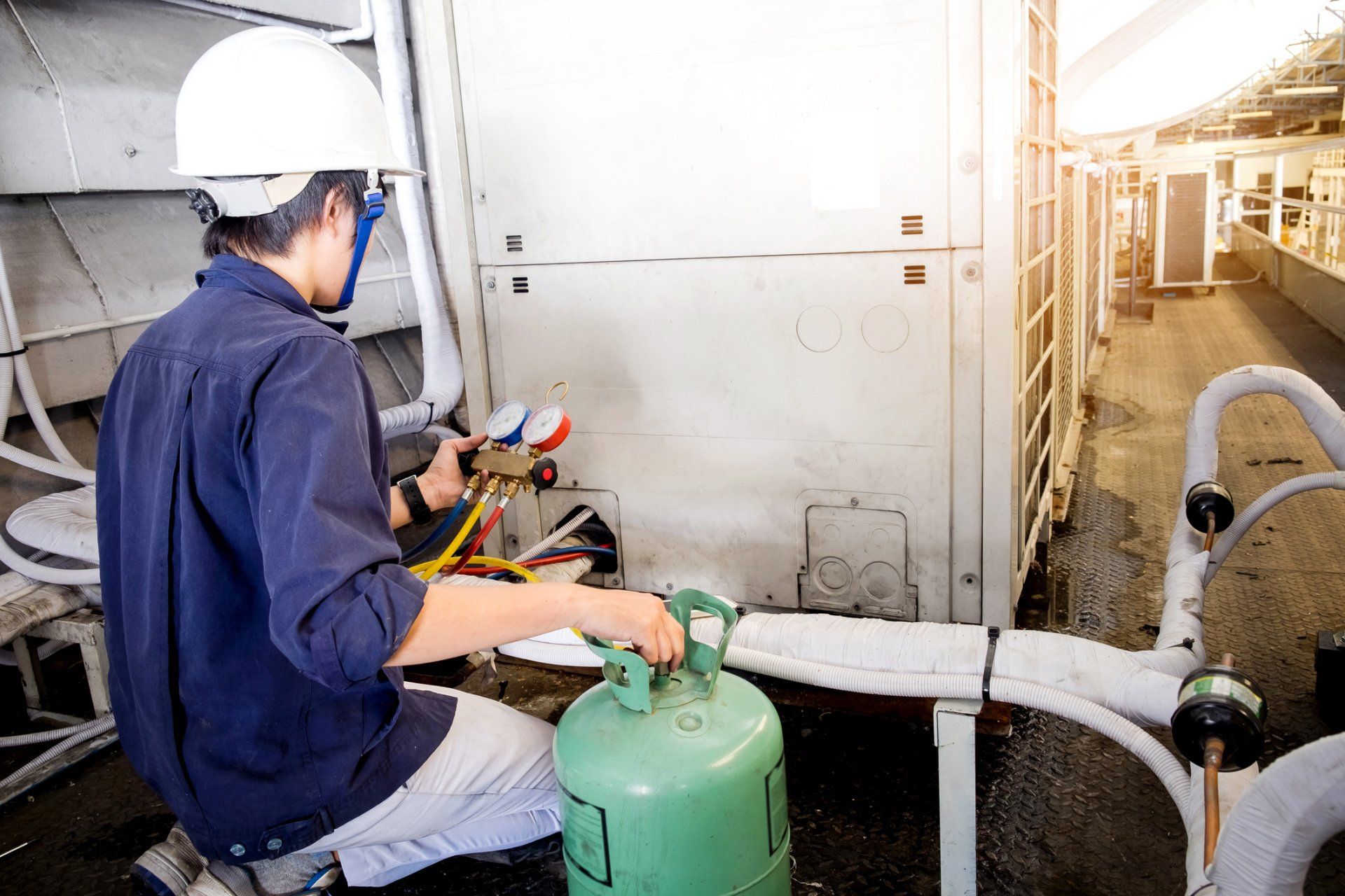 HVAC Expert Checking The Machine — Berkeley, CA — Cooper & Hawkins Engineering