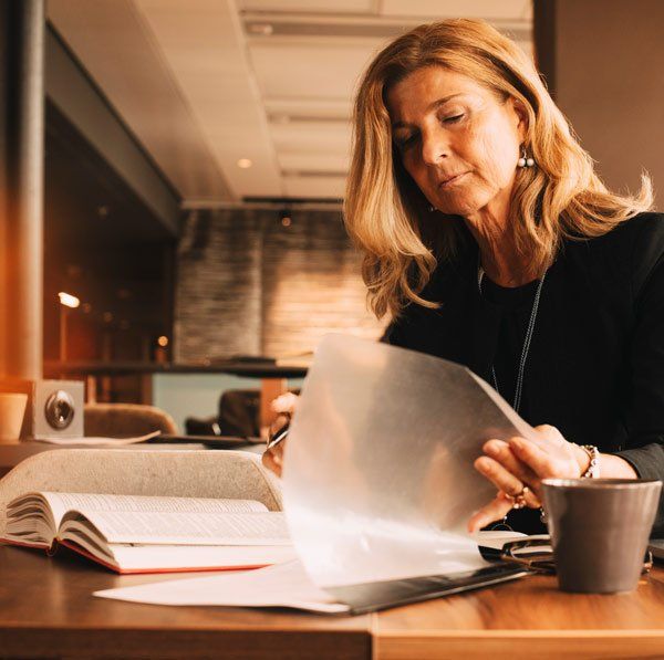 woman looking through documents