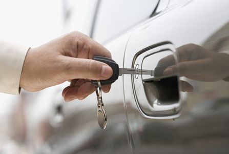 man opening the car with a key