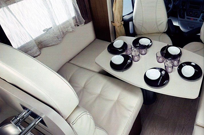 Camper living area with light upholstery