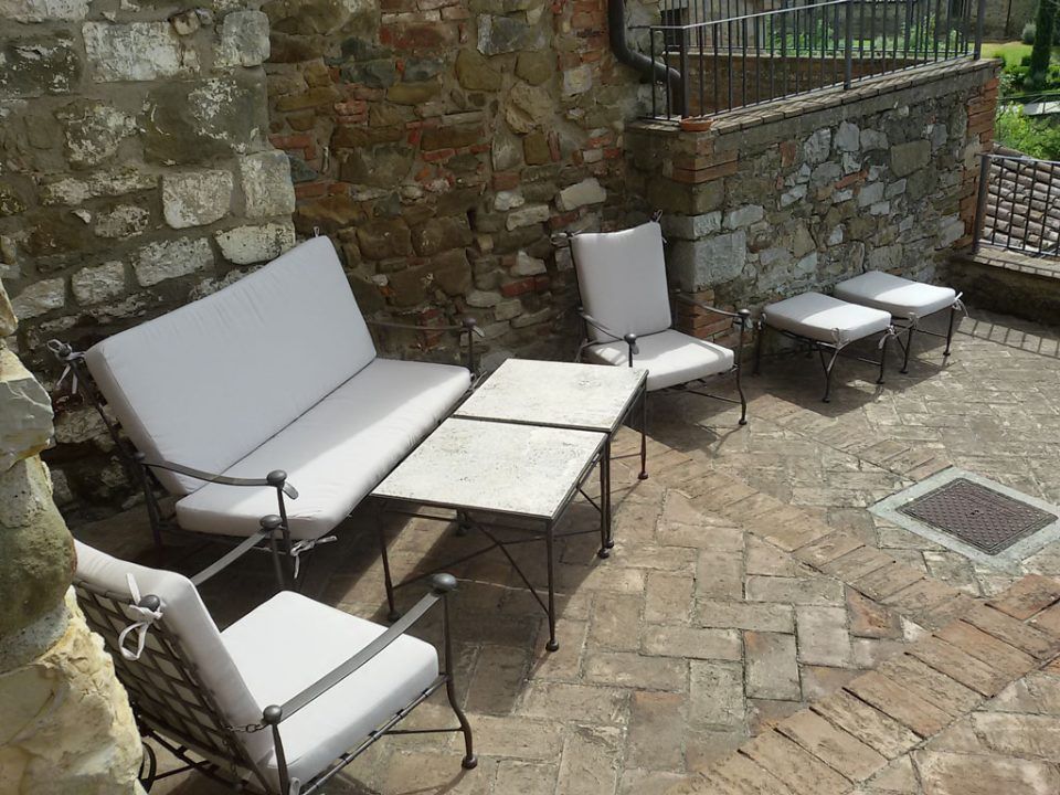 outdoor living area with white cushions