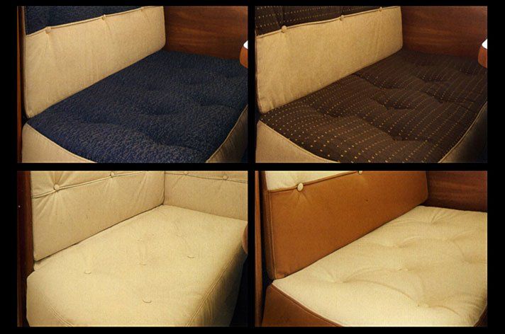 four small sofas upholstered in different colours
