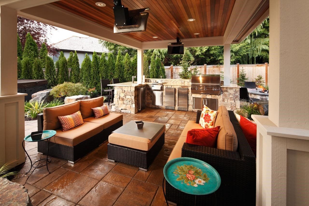 A patio area with a couch and a table