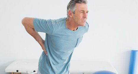 man suffering with a back pain