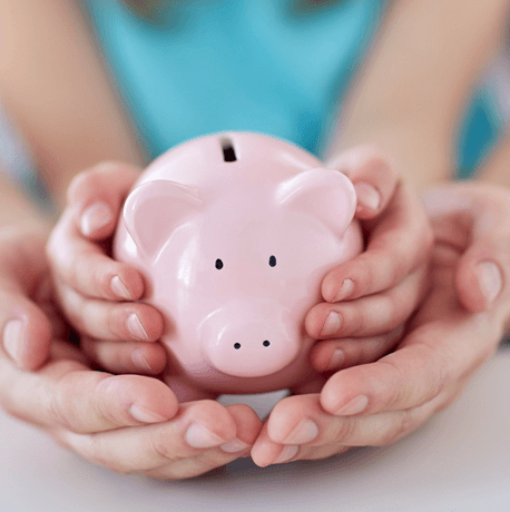 Young kid with a piggy bank for investment