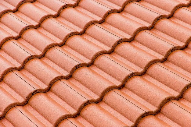 Terracotta roof tiles arranged in neat rows
