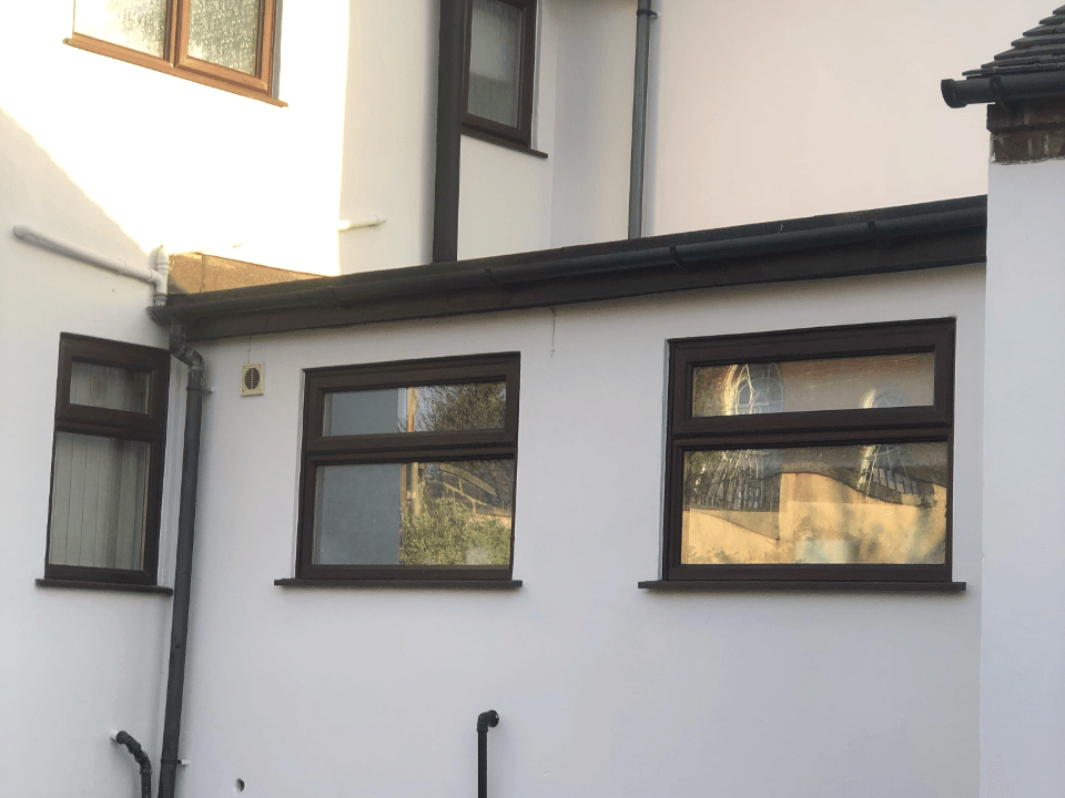 Picture of a rendered house and off shot newly painted in white by Painters and Decorators Birmingham.