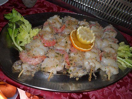 spiedini di gamberi e calamari gratinati