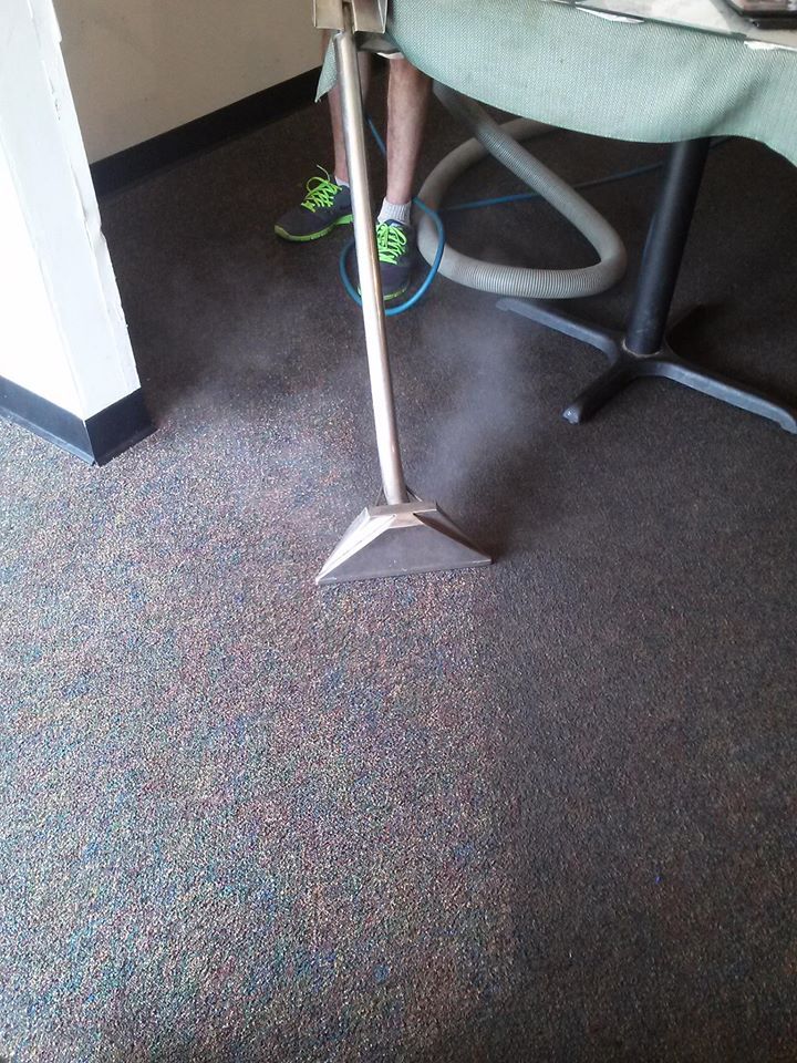 A Man Cleaning the Carpet — Naples, FL — Superior Steam