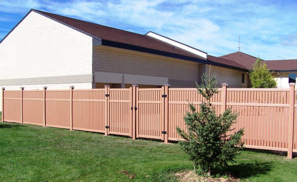 A house with a vinyl fence 