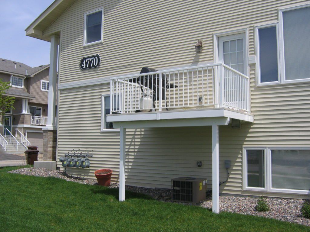 A house with a small white balcony