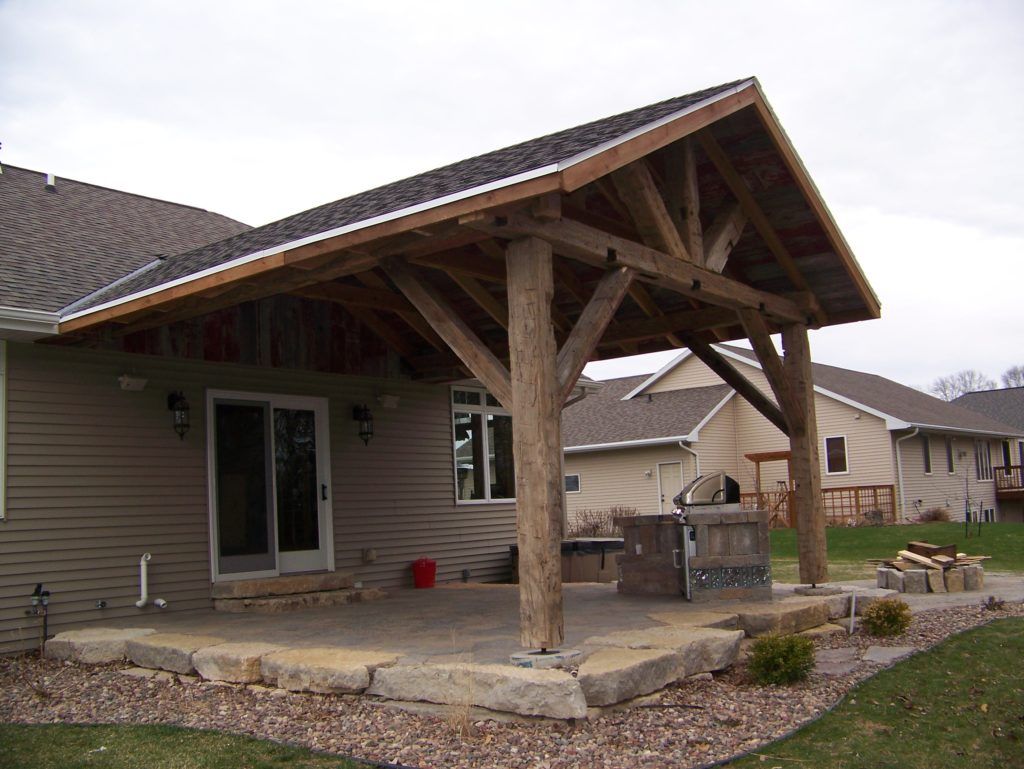 A house with a covered patio in back of it