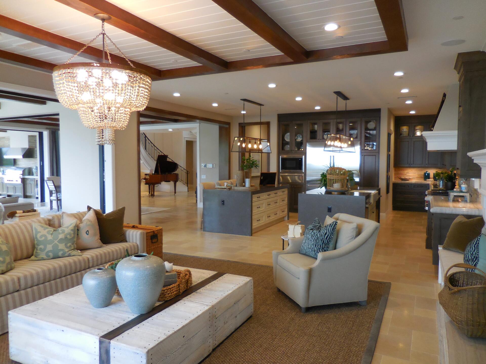 a living room with a couch and chairs and a coffee table
