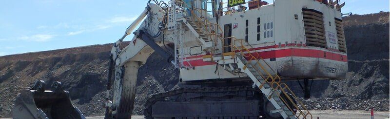 Large White Excavator - Commercial Inspection & Testing Mackay