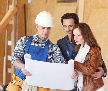 Worker and Couple Talking About the Floor Plan — Renovation in Woolgoolga, NSW Worker and Couple Talking About the Floor Plan — Renovation in Woolgoolga, NSW