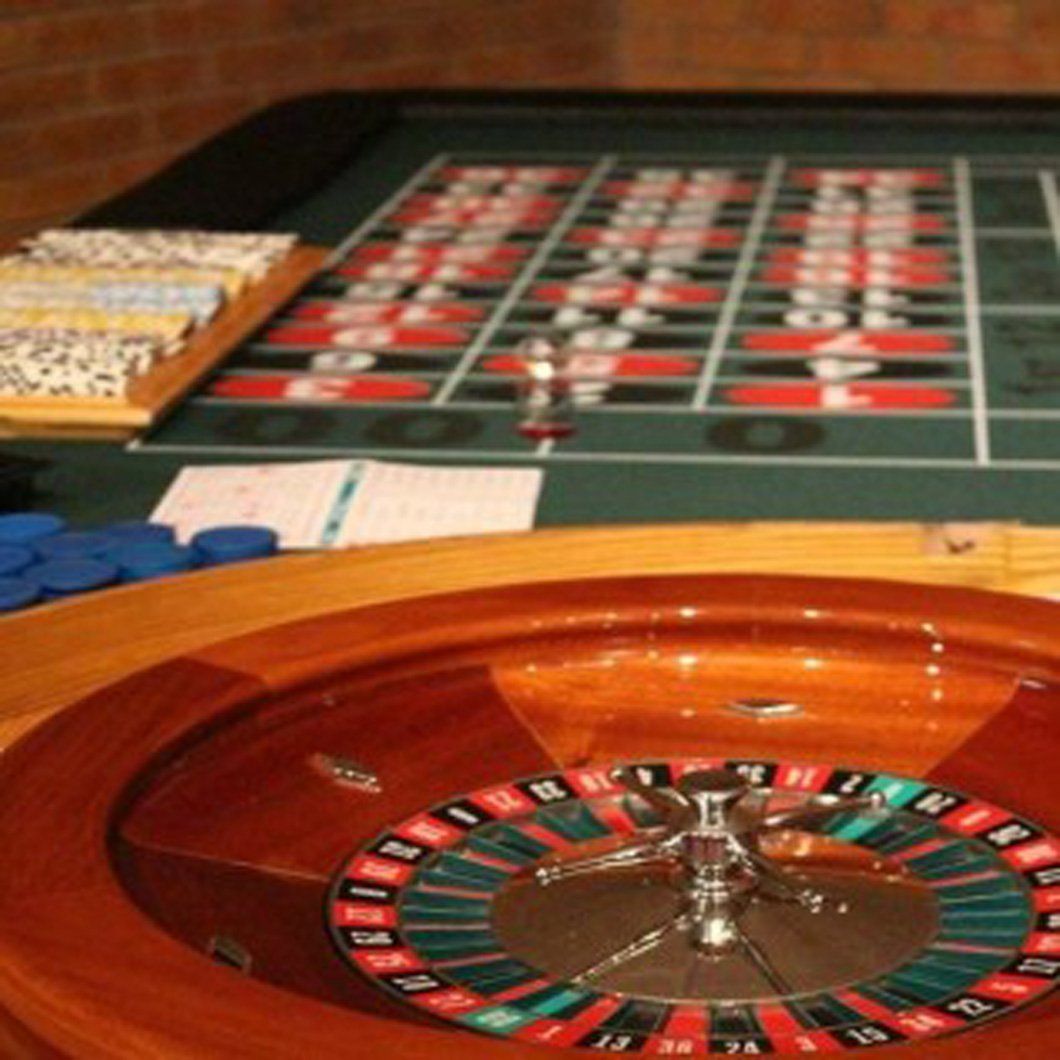 A close up of a roulette wheel on a table