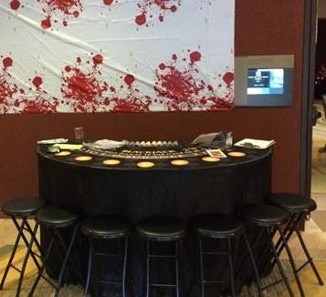 I view of a blackjack table and stools open for players
