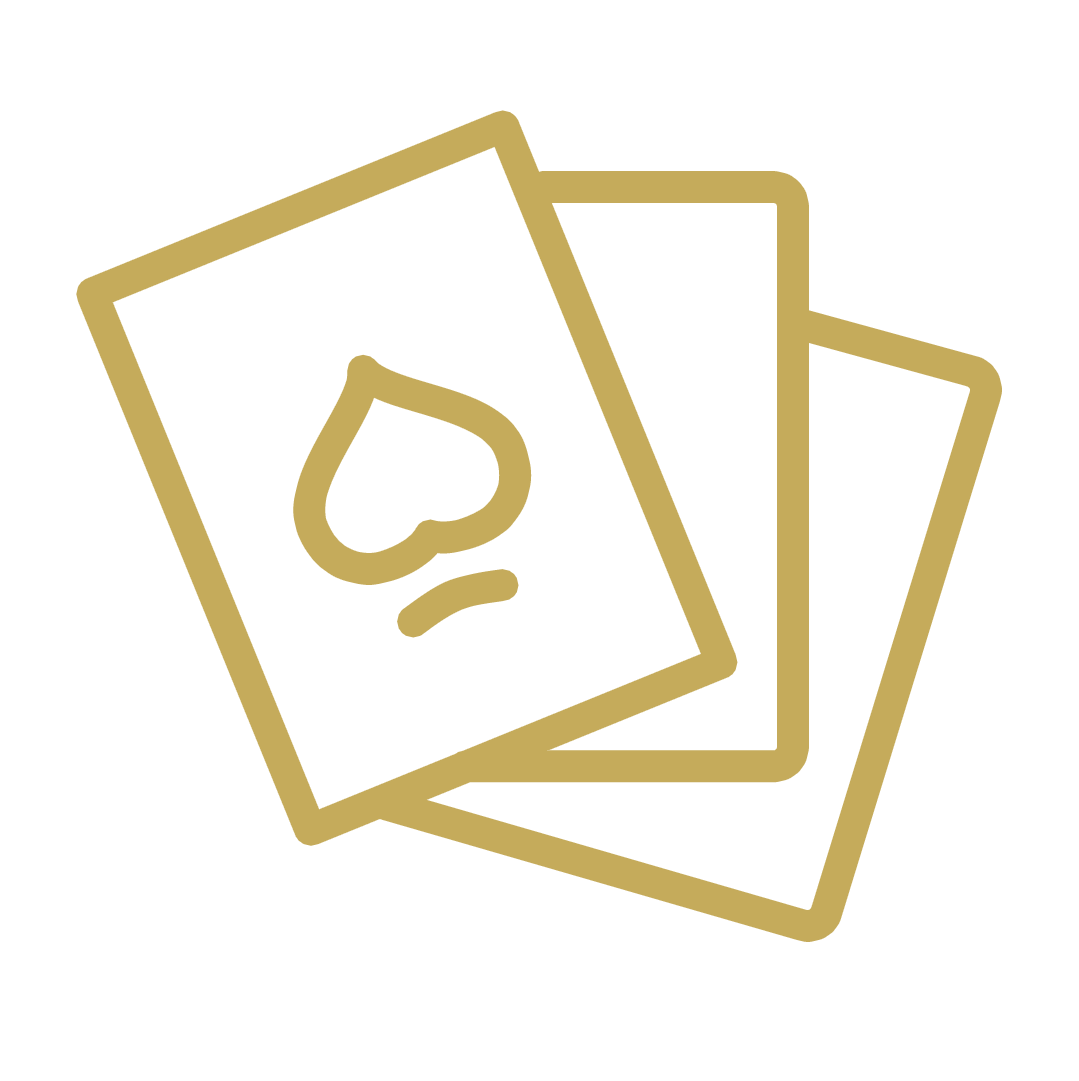 Three playing cards are stacked on top of each other on a white background.