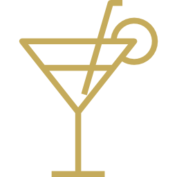 A martini glass with a straw in it.
