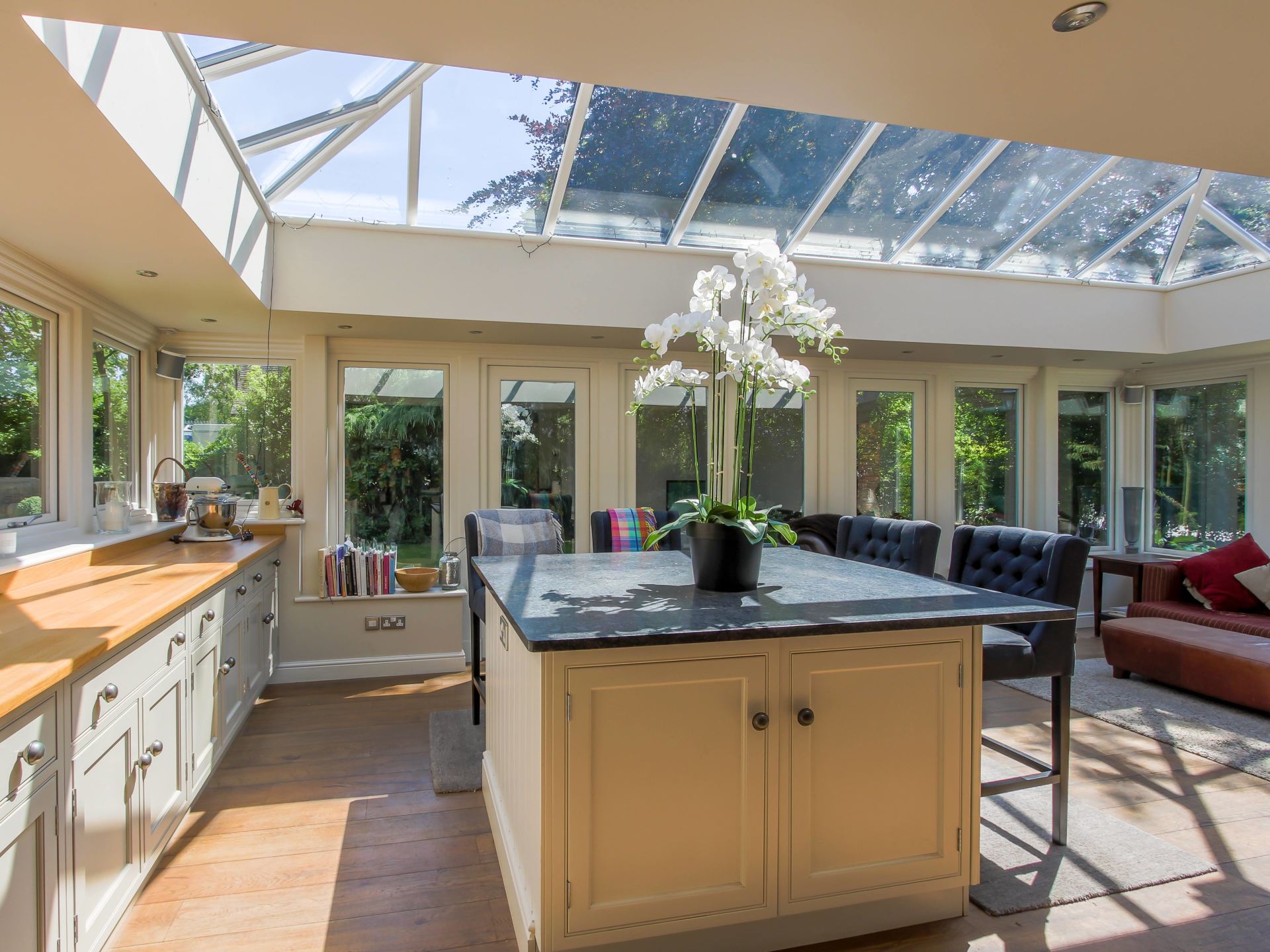 Interior View of Home Orangery With Breakfast Bar and Bar Stools