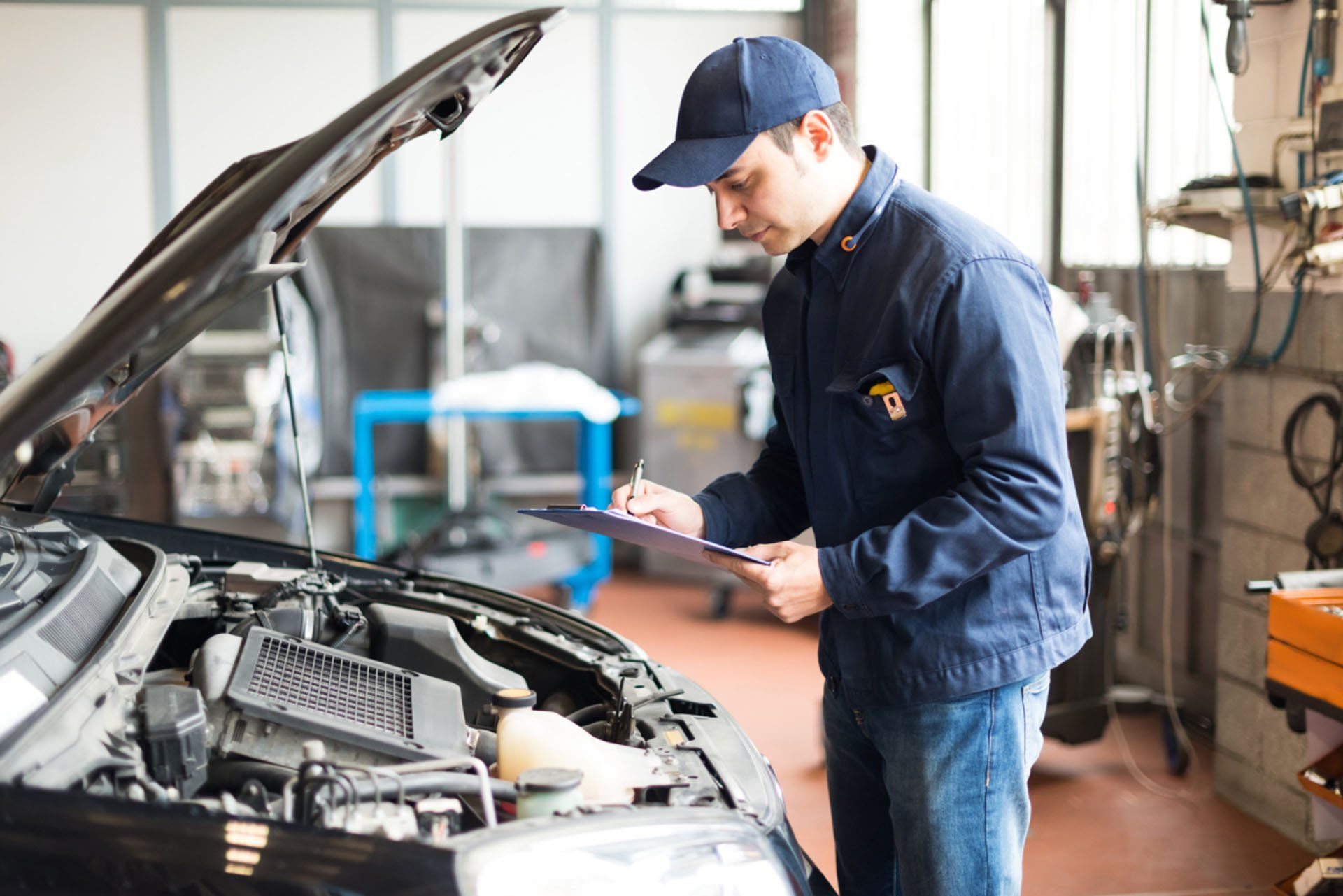 mechanic checking engine