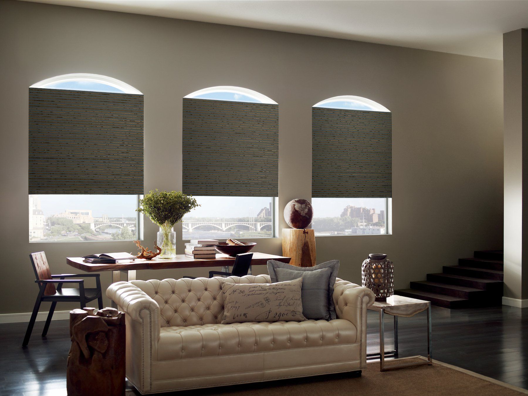 Wood woven shades covering windows in a living room