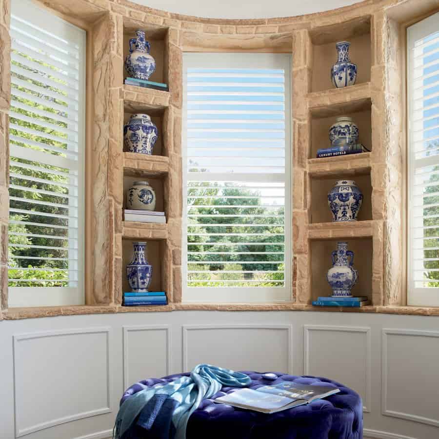 Sitting room with custom Hunter Douglas Palm Beach Shutters