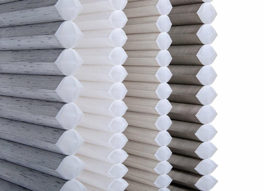 Close up of honeycomb shade designs from a side angle