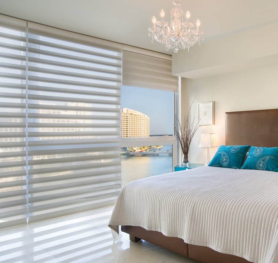 Sunny master bedroom in Burien, WA with Pirouette window shadings installed