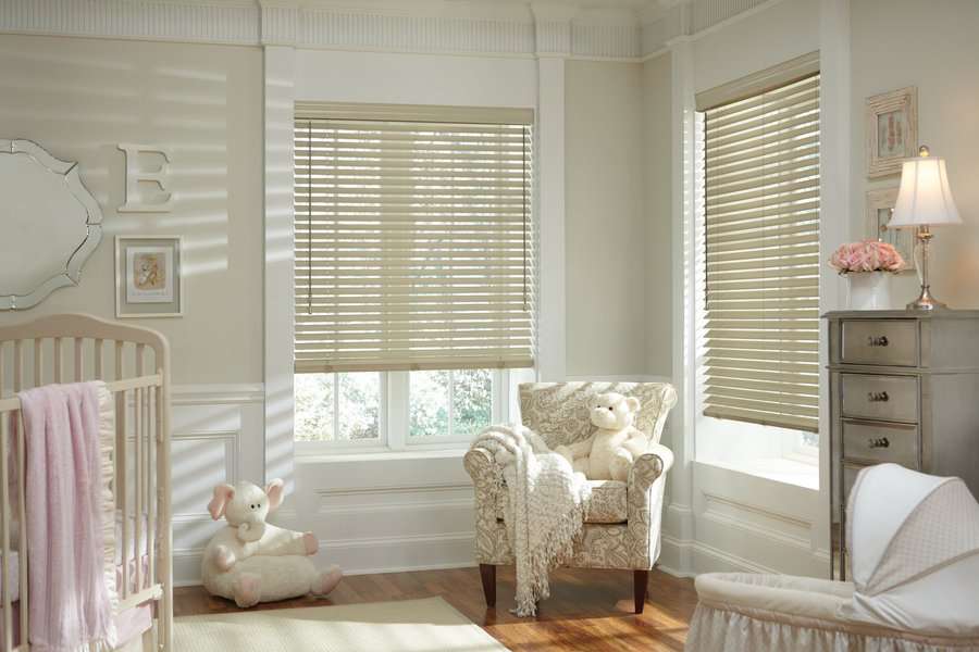 Baby room in Covington, WA with Parkland wood blinds installed