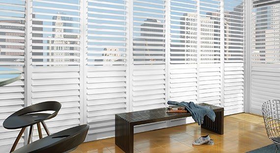 Home office with Hunter Douglas NewStyle Hybrid Shutters Wood Interior Window Shutters — Kent, WA