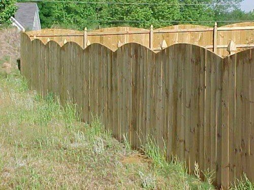 Arched wood picket fence.