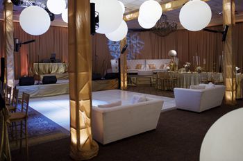 There is a dance floor in the middle of the room.