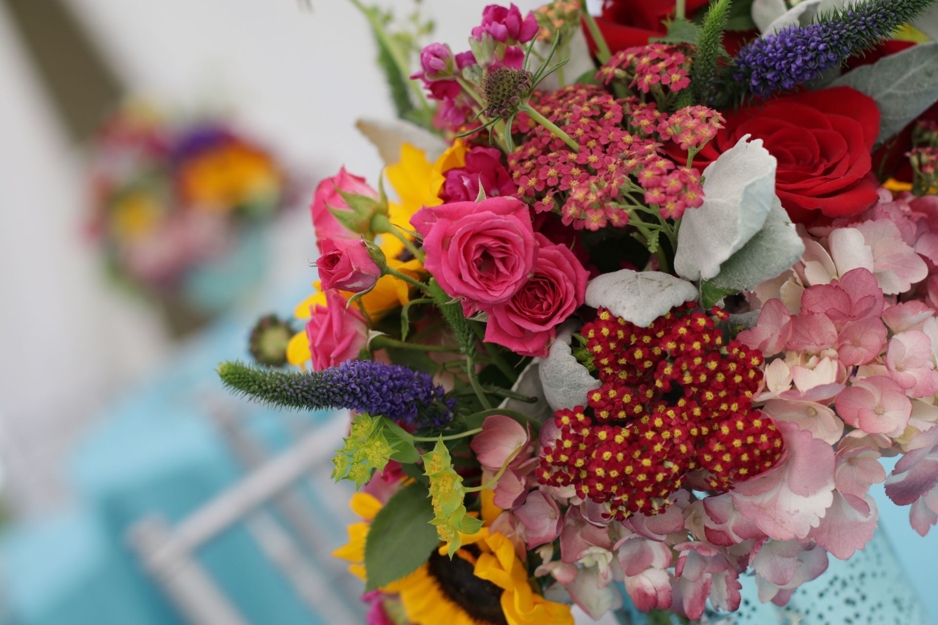 A close up of a bouquet of flowers on a table.