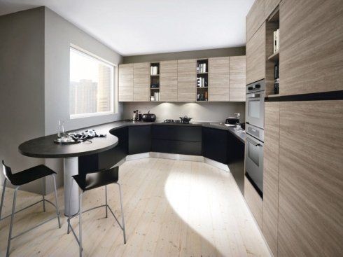 una cucina angolare di color nero e marrone