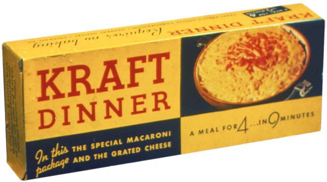 Box of Kraft Dinner macaroni and cheese, yellow and blue, with text and a picture of prepared dish.
