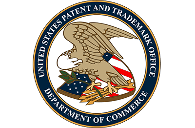 United States Patent and Trademark Office seal with eagle, red/white shield, blue banner.