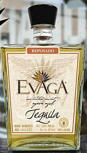 Bottle of Evaga Reposado tequila with a black cap, featuring a light brown label and clear glass.