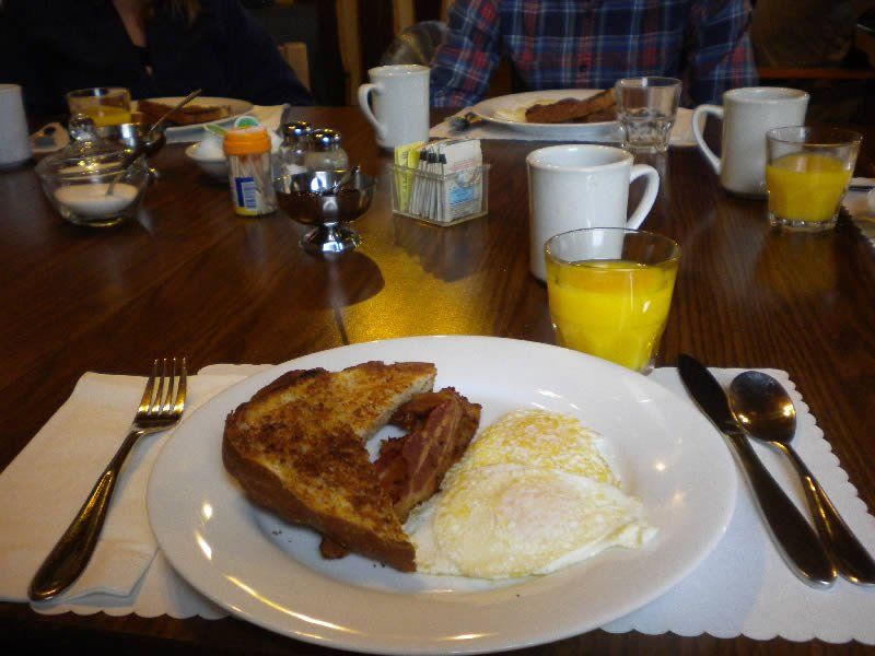 Breakfaster of bacon, eggs, and toast.