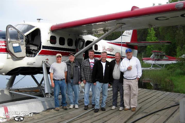 A group of fisherman standing on the dock at Wilderness Air.