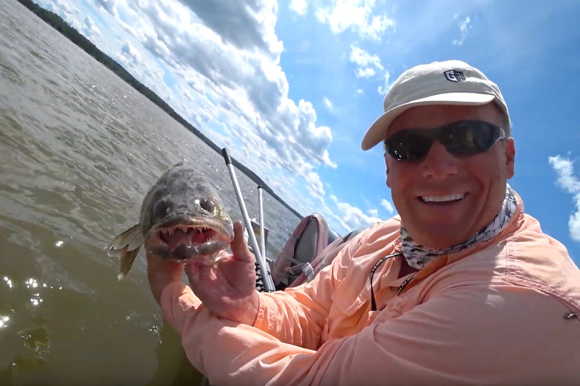 Man holding a walleye fish