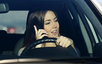 Making a phone call while driving - Insurance agency in Stoughton, MA Making a phone call while driving - Insurance agency in Stoughton, MA