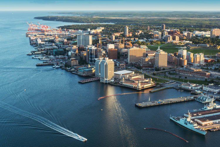 An aerial view of a city surrounded by water and buildings.